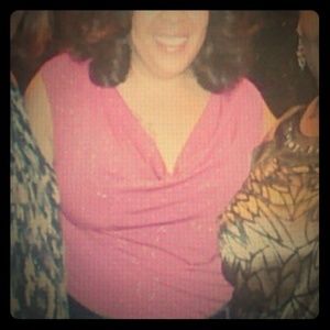 Pink sleeveless top with glitter detail.